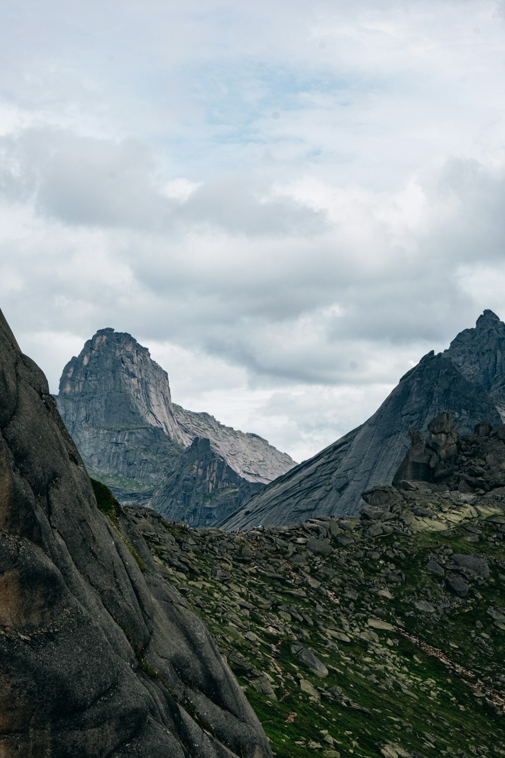 a person standing on top of a large rock