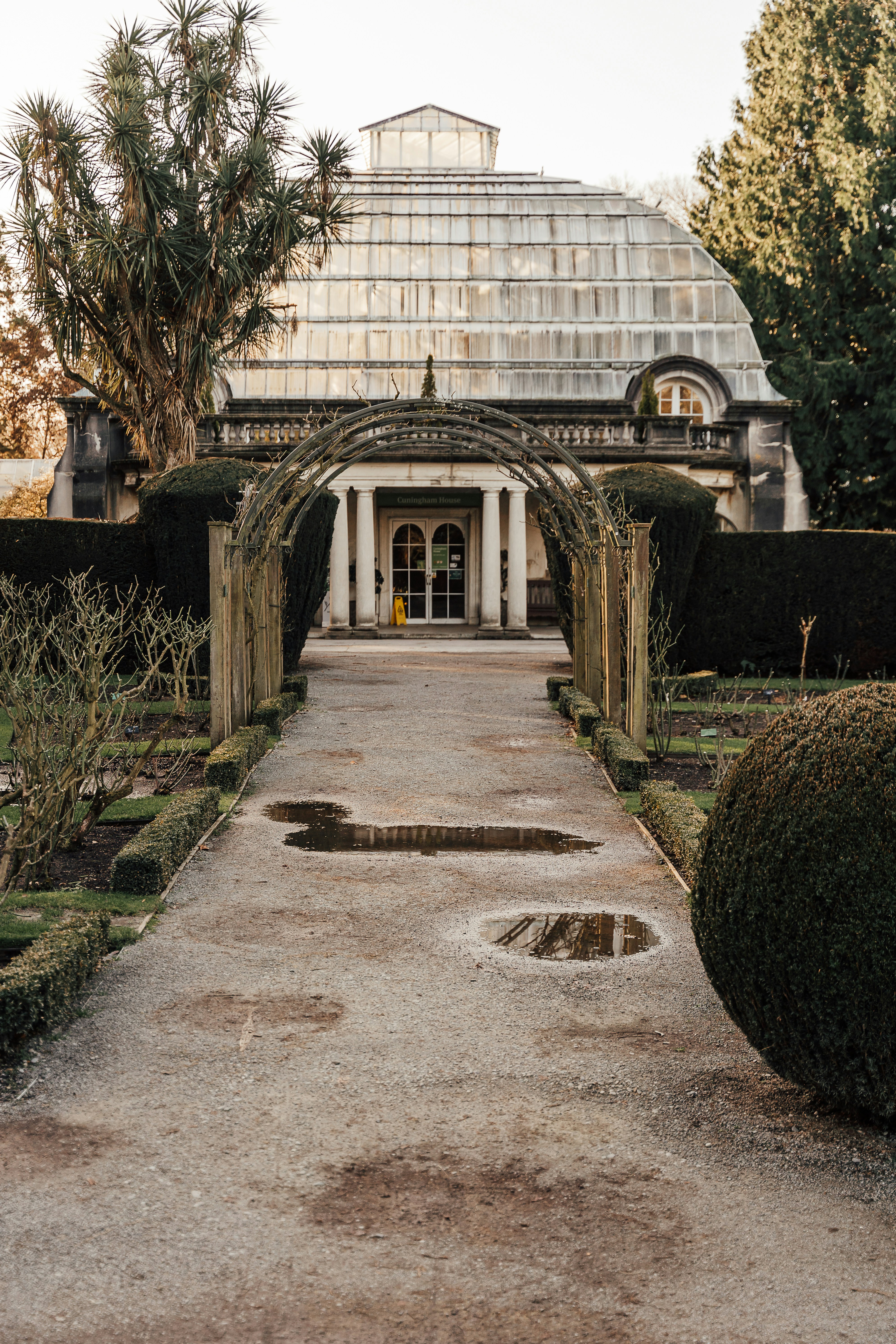 a stone walkway leading to a large building