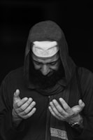 a man with a beard wearing a hoodie