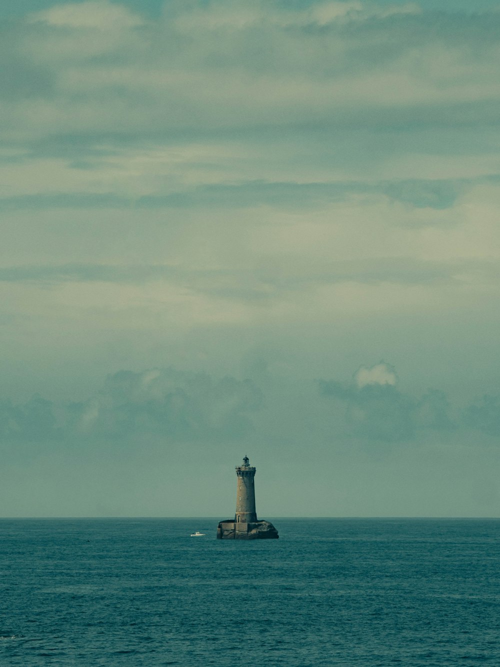 a light house in the middle of the ocean