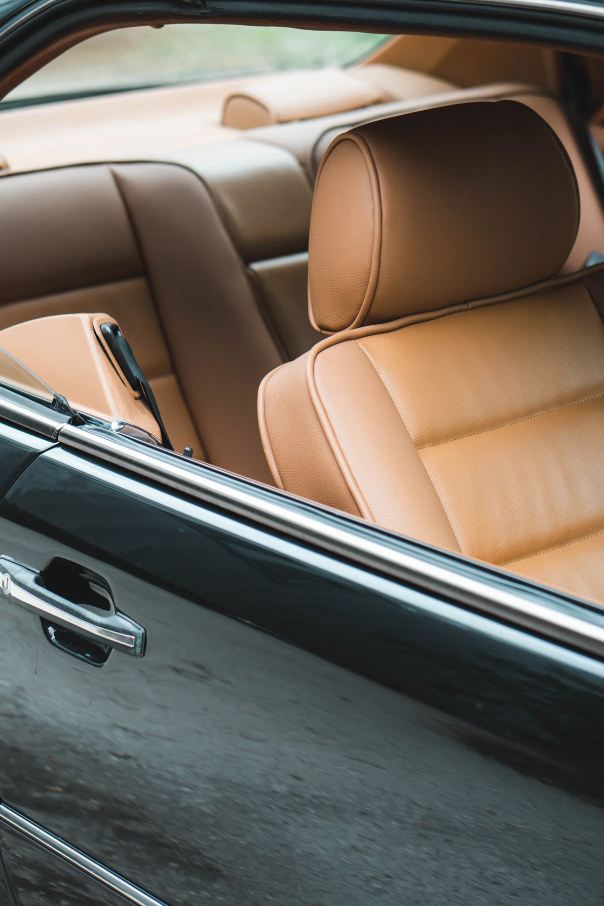 the interior of a car with the door open