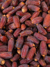a close up of a pile of raisins