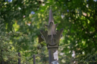 Iron fence posts with decorative finials lining a private outdoor space in Qatar