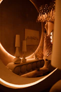Elegant wall art pieces hanging above a minimalist console table with soft ambient lighting.