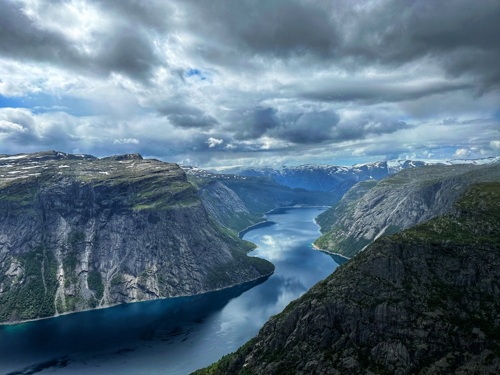 a view of a body of water surrounded by mountains