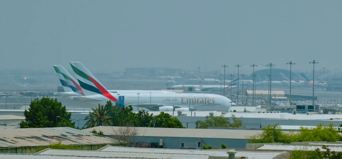 A large passenger jet parked on a sunny airport tarmac