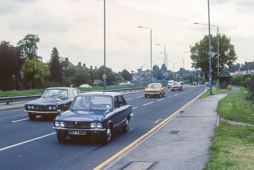 a couple of cars that are sitting in the street