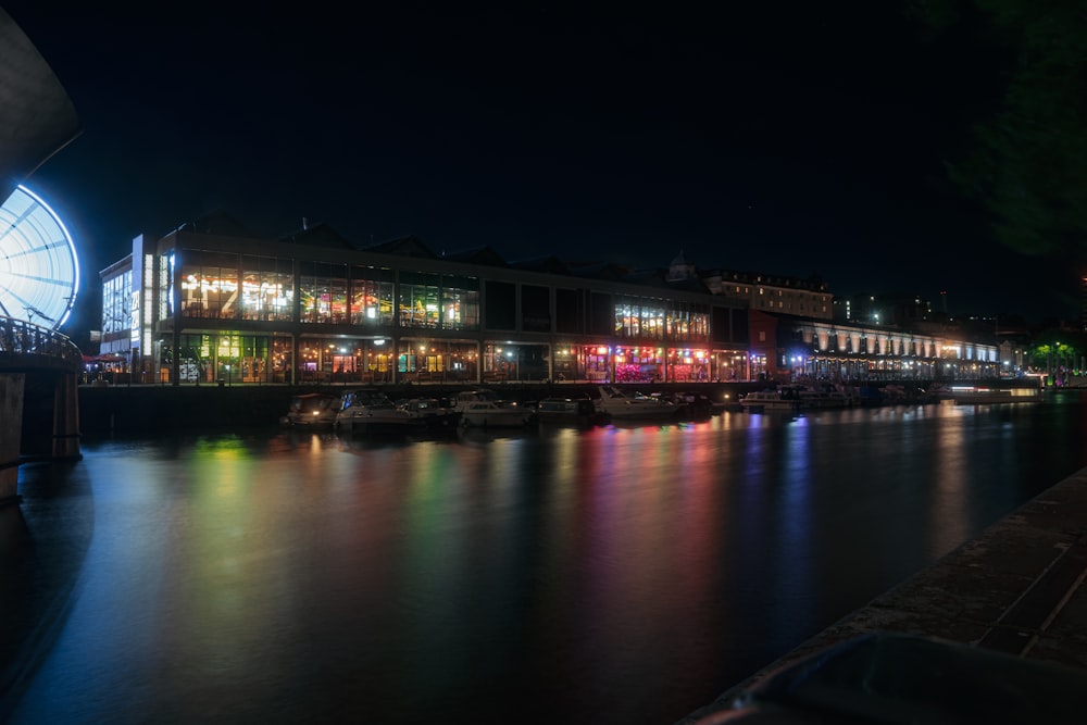 a night time view of a city with a river running through it