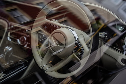 the interior of a car with a steering wheel and dashboard