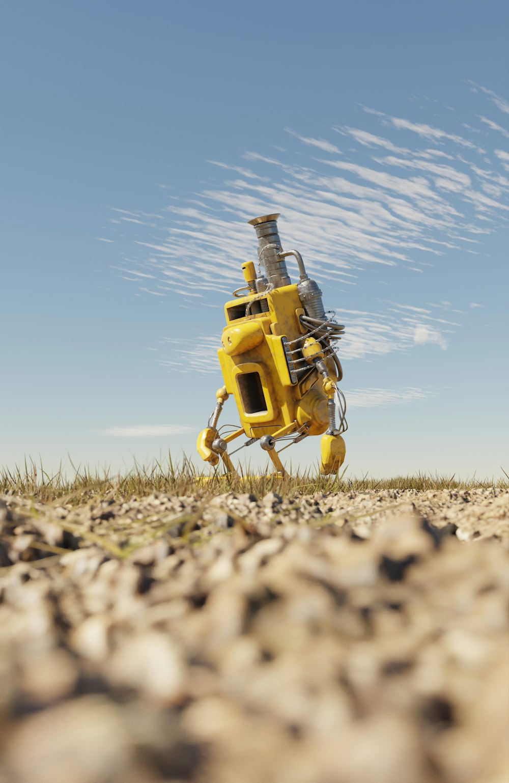 a yellow robot sitting in the middle of a field