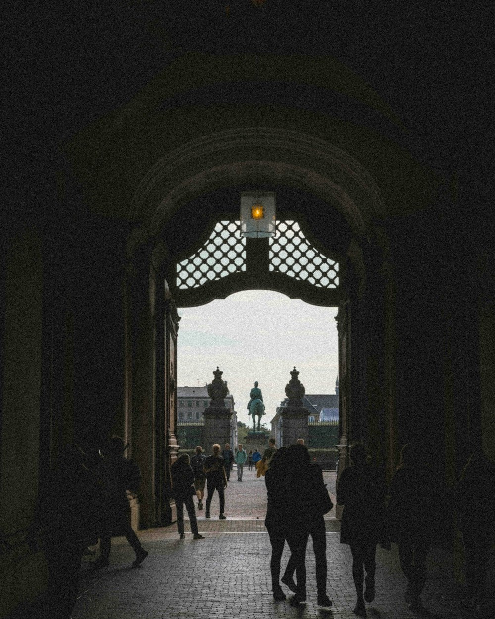 a group of people walking through a doorway