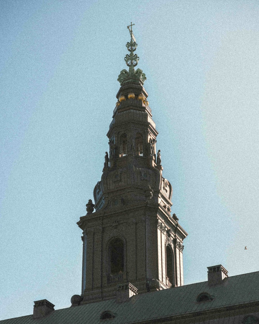 a tall building with a clock on the top of it