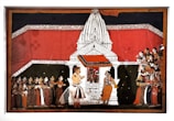 A detailed Indian painting showcases a traditional scene with a large white temple structure in the center. The temple is adorned with intricate designs and has a vivid red backdrop. In front of the temple, two figures are prominently positioned, one of whom appears to be in conversation with the other. To the left and right, groups of people are attentively gathered, wearing colorful traditional attire, indicating a ceremonial or religious gathering.