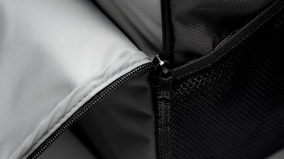 Close-up of a navy blue jacket’s zipper and soft fleece lining.