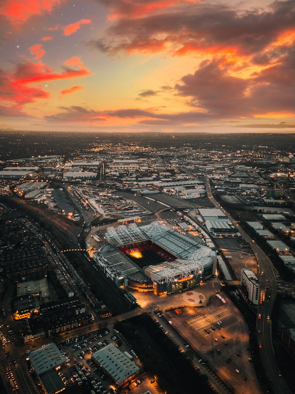 an aerial view of a stadium at sunset