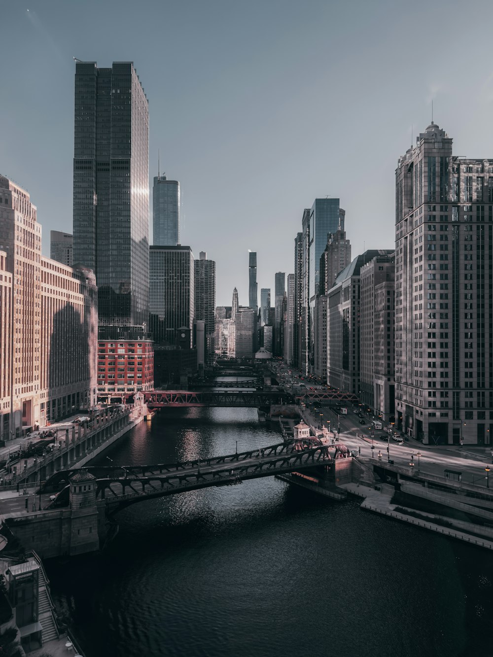 a river running through a city next to tall buildings