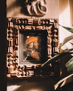 A minimalist portrait of Juan Carlos with subtle gold accents highlighting his determined expression.