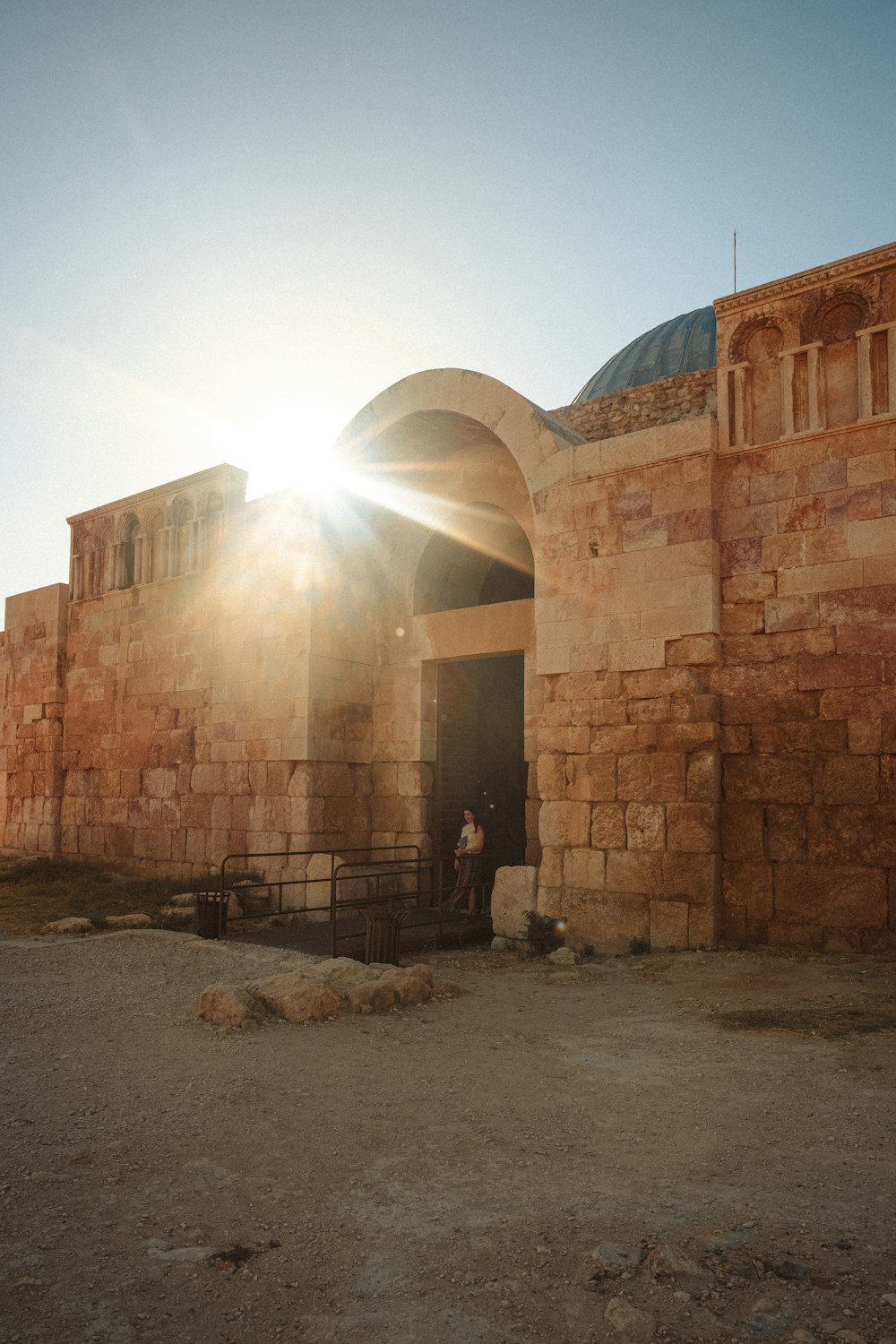 a person standing in a doorway of a building