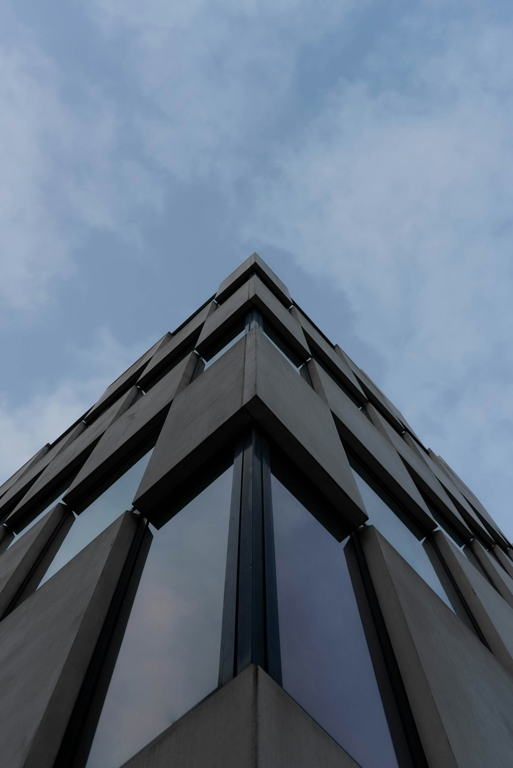 a tall building with a sky background