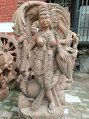 Granite sculptures depicting traditional deities, showcasing detailed craftsmanship.