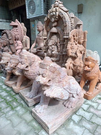 A collection of hand-carved stone statues showcasing detailed artistry.