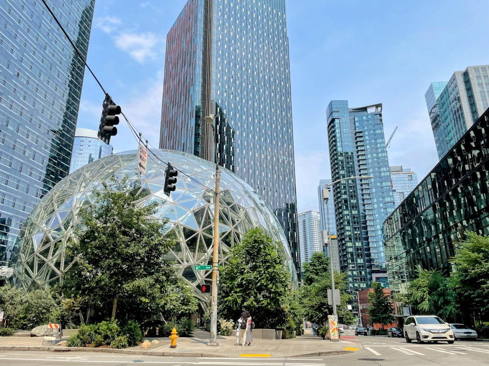 a city street with tall buildings and a traffic light