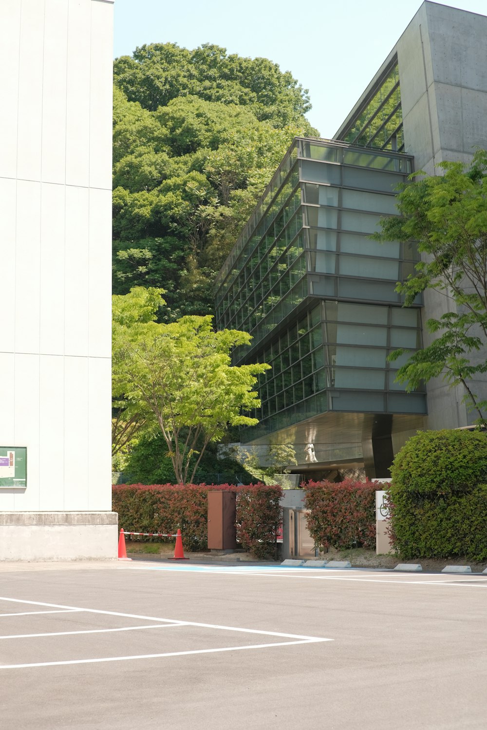 a parking lot with a building in the background