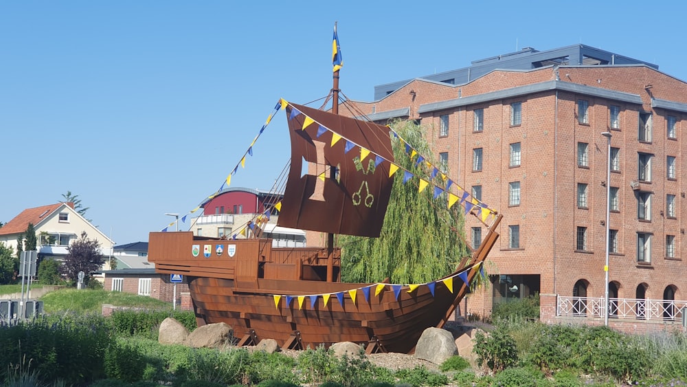 a replica of a pirate ship in front of a building