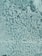 A frosted glass surface with a textured pattern resembling bubbles or raindrops. The light reflects off the uneven surface, creating varying shades and a sense of depth.