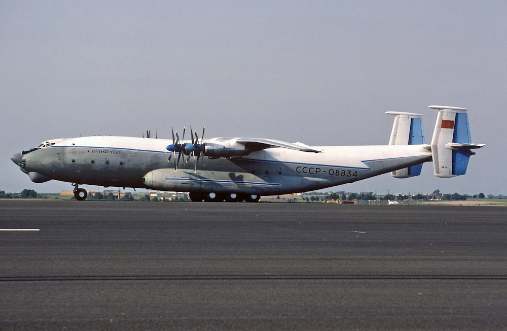 a large air plane sitting on top of an airport runway