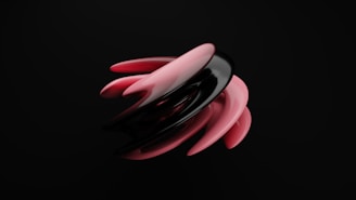 A dynamic, abstract sculpture composed of sleek, curved shapes in black and pink, contrasting sharply against a solid black background. The design features a smooth, glossy texture, creating an interplay of light and shadow that gives the shapes a sense of fluid motion.