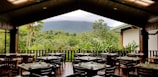 Aerial view of Club del Bosque’s outdoor dining area with lush green surroundings
