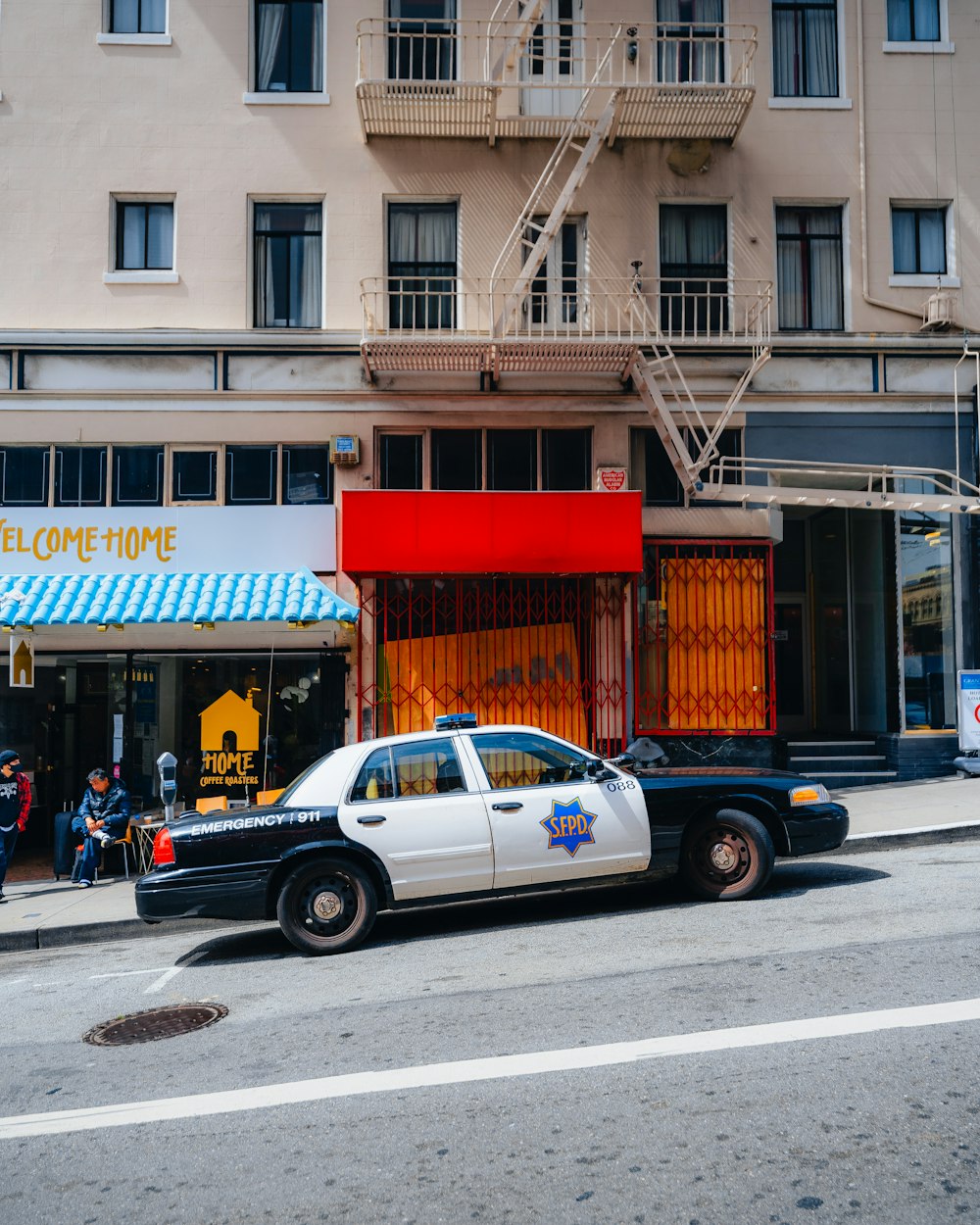 a police car parked in front of a building