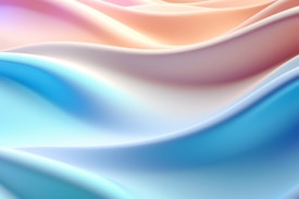 Soft, flowing waves of pastel colors seamlessly blend into each other, creating a soothing and calming visual effect. The image features gradients of light blues, pinks, and warm peaches with smooth, undulating curves and a silky texture.