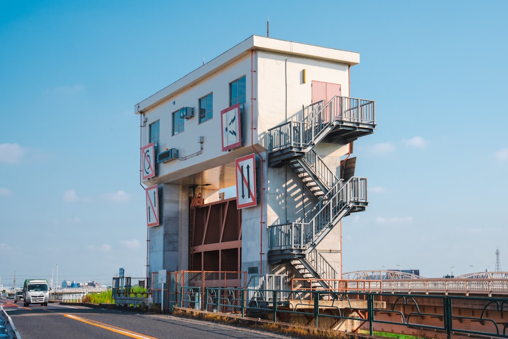 a tall building with a staircase going up the side of it