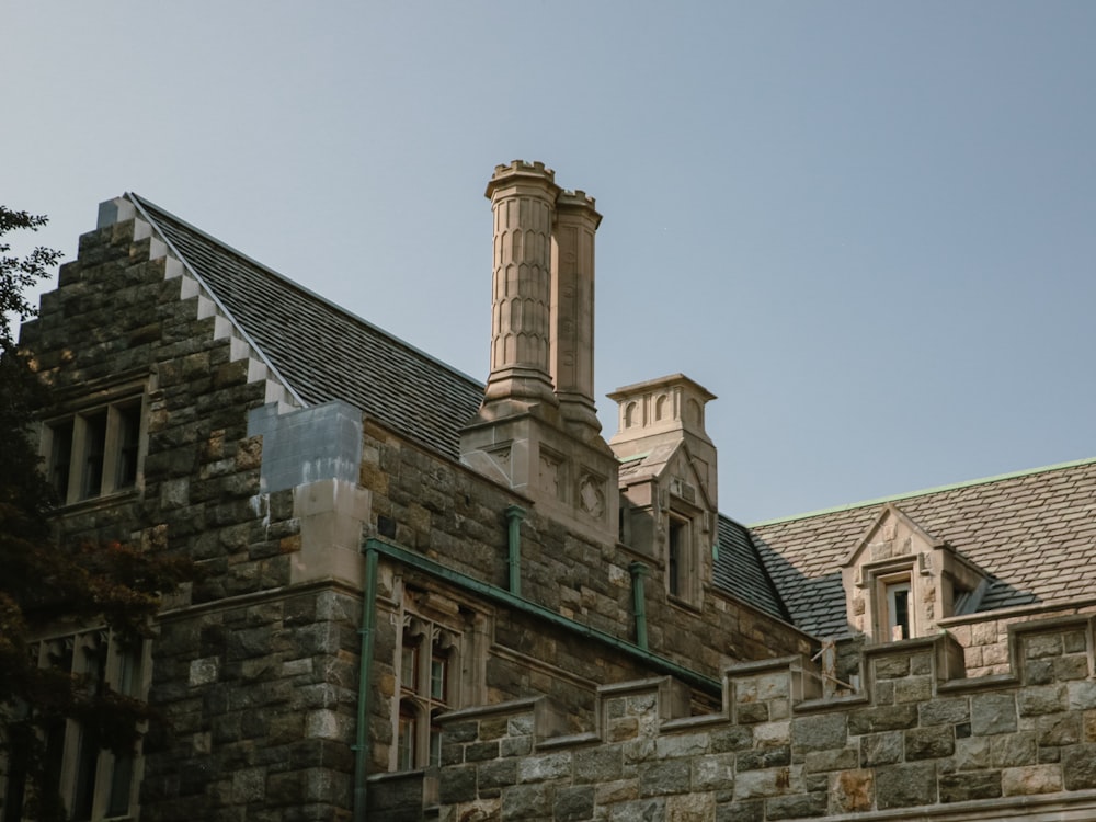 a stone building with a clock tower on top of it