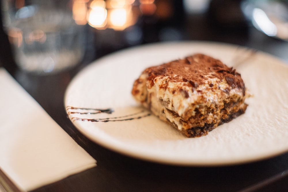 a piece of food sitting on top of a white plate