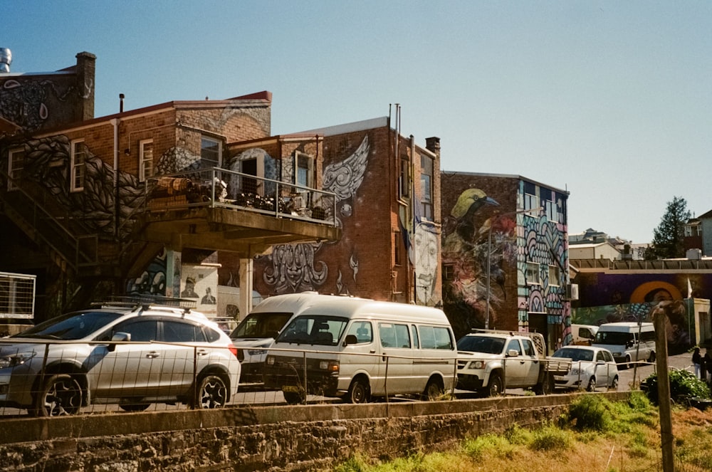 a bunch of cars parked on the side of the road