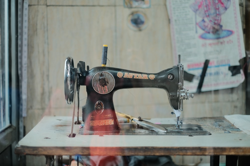 a sewing machine sitting on top of a wooden table