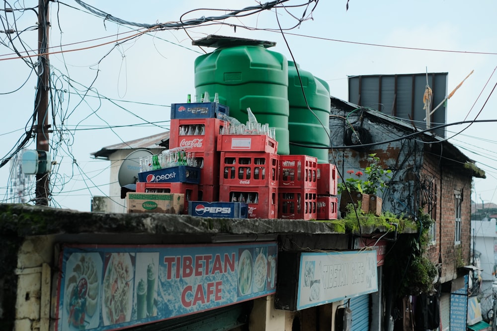 a green tank sitting on top of a building