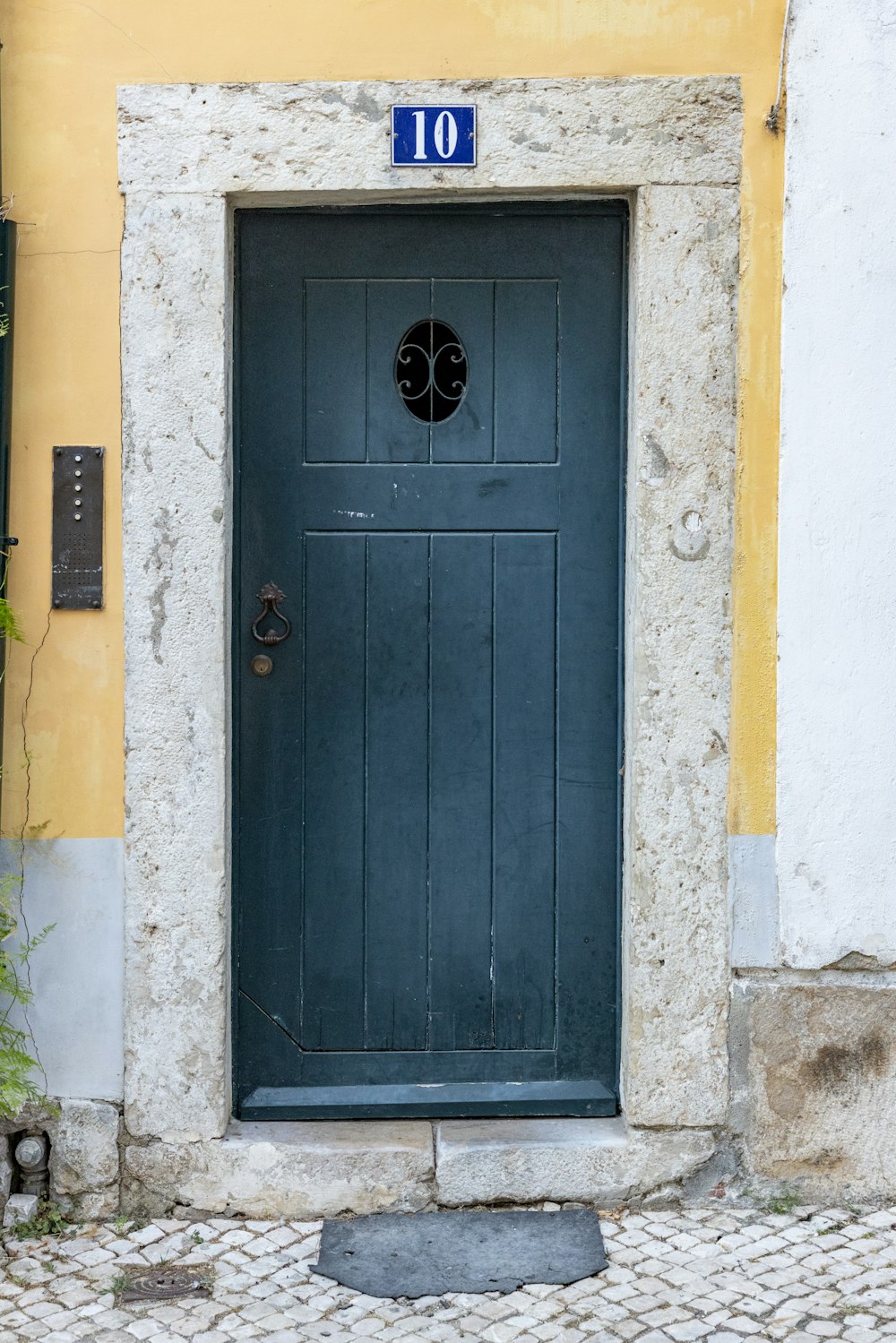 a blue door with a number on it