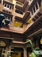 A charming courtyard of a Lucknow BnB with traditional decor and warm lighting.