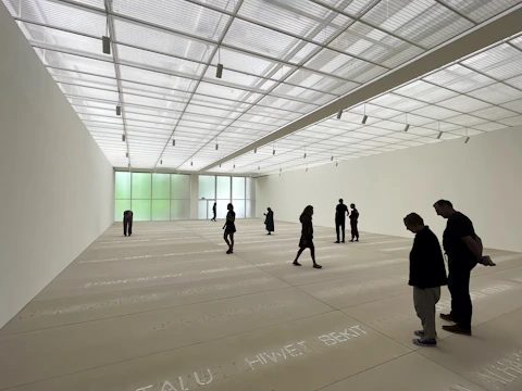 A panoramic view of a sunlit modern art gallery captured in vivid VR detail.