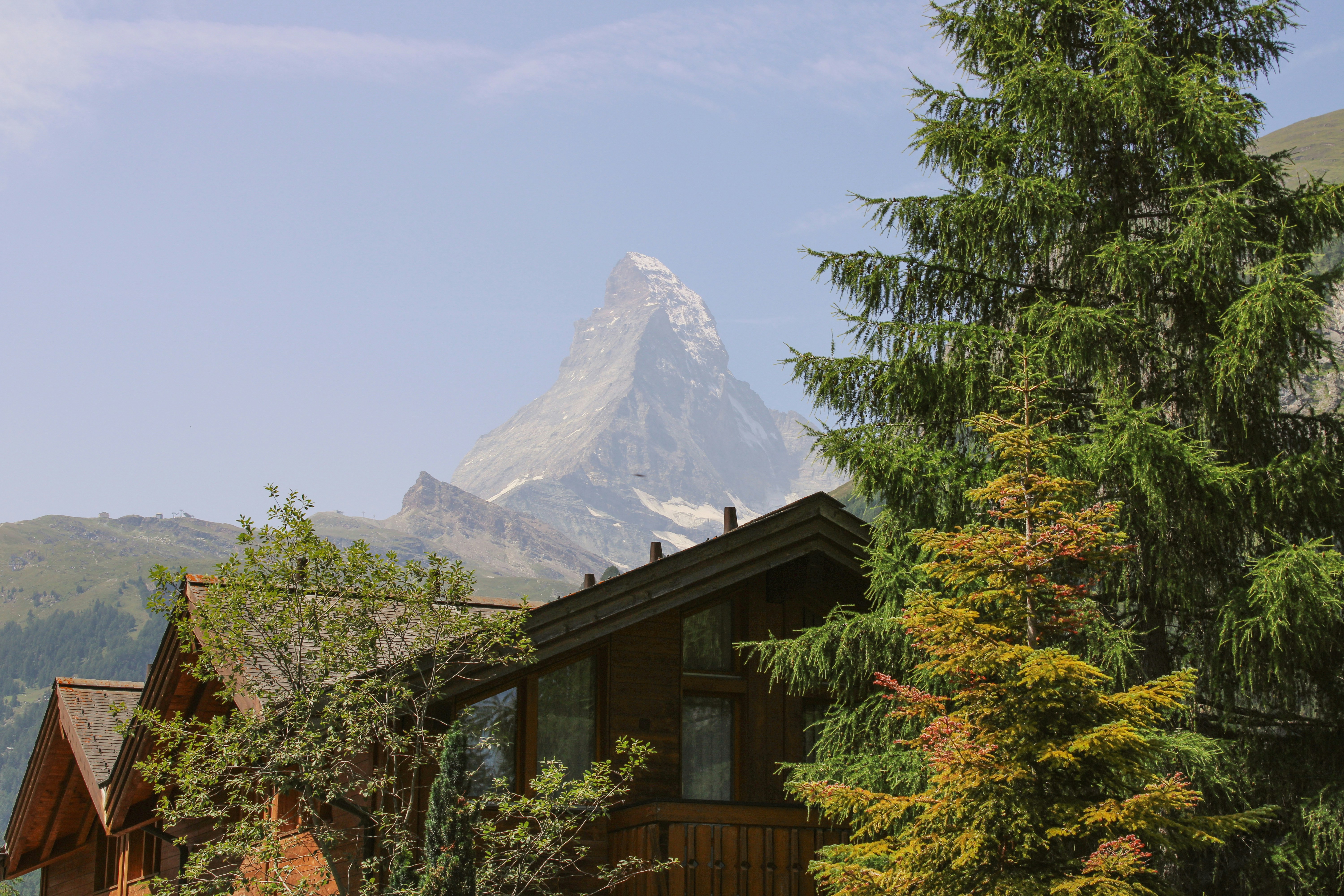 a house with a mountain in the background