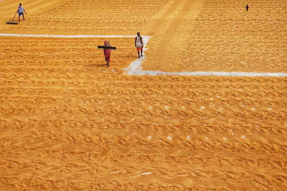 a couple of people that are standing in the dirt