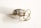 A pair of gold rings is lying on a white surface. One of the rings is adorned with several large, clear gemstones, possibly diamonds, set in a double row of smaller gemstones.