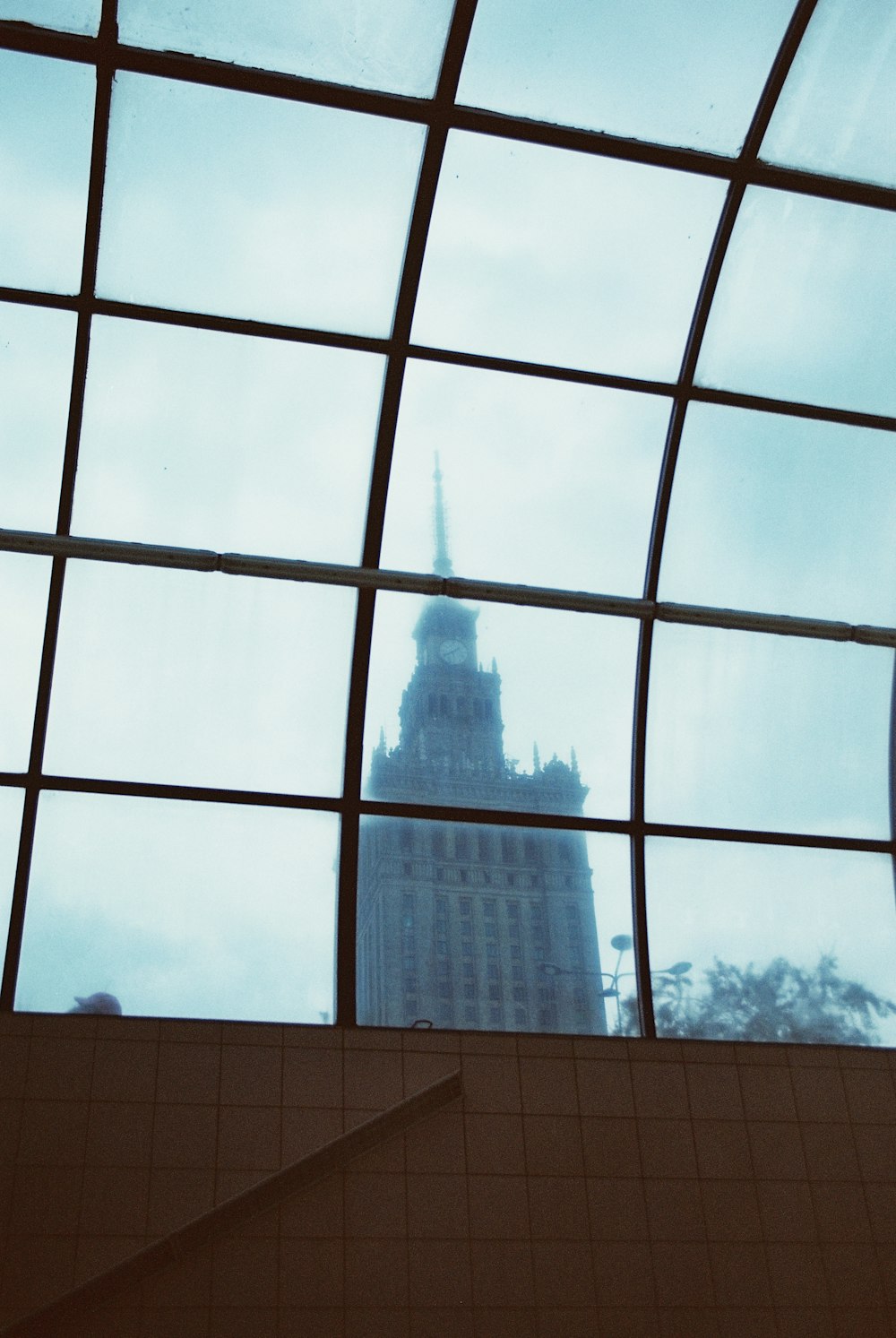 a view of a building through a glass window