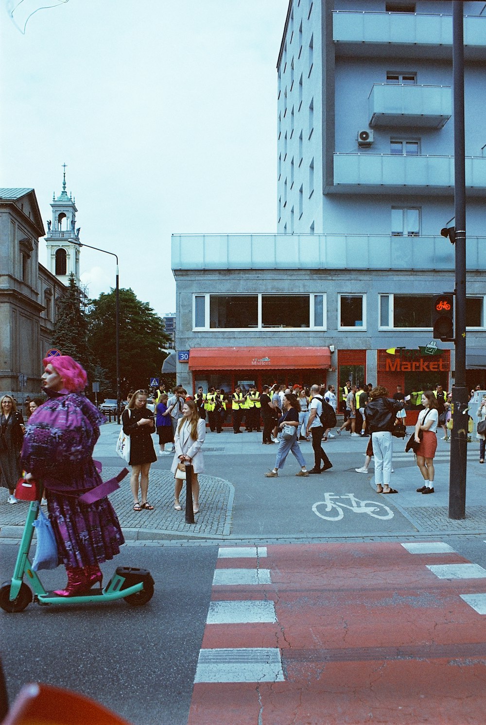 a person riding a scooter on a city street