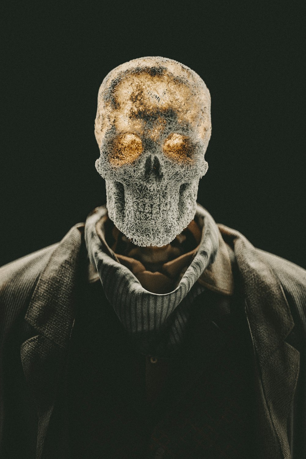 a man with a skull mask on his head