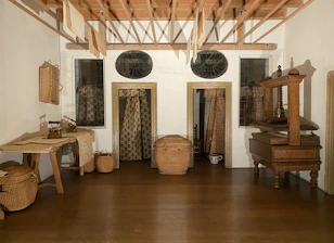Drying equipment set up in a living room to restore moisture levels.